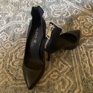 Gently used Aldo stiletto pumps with zipper detail.